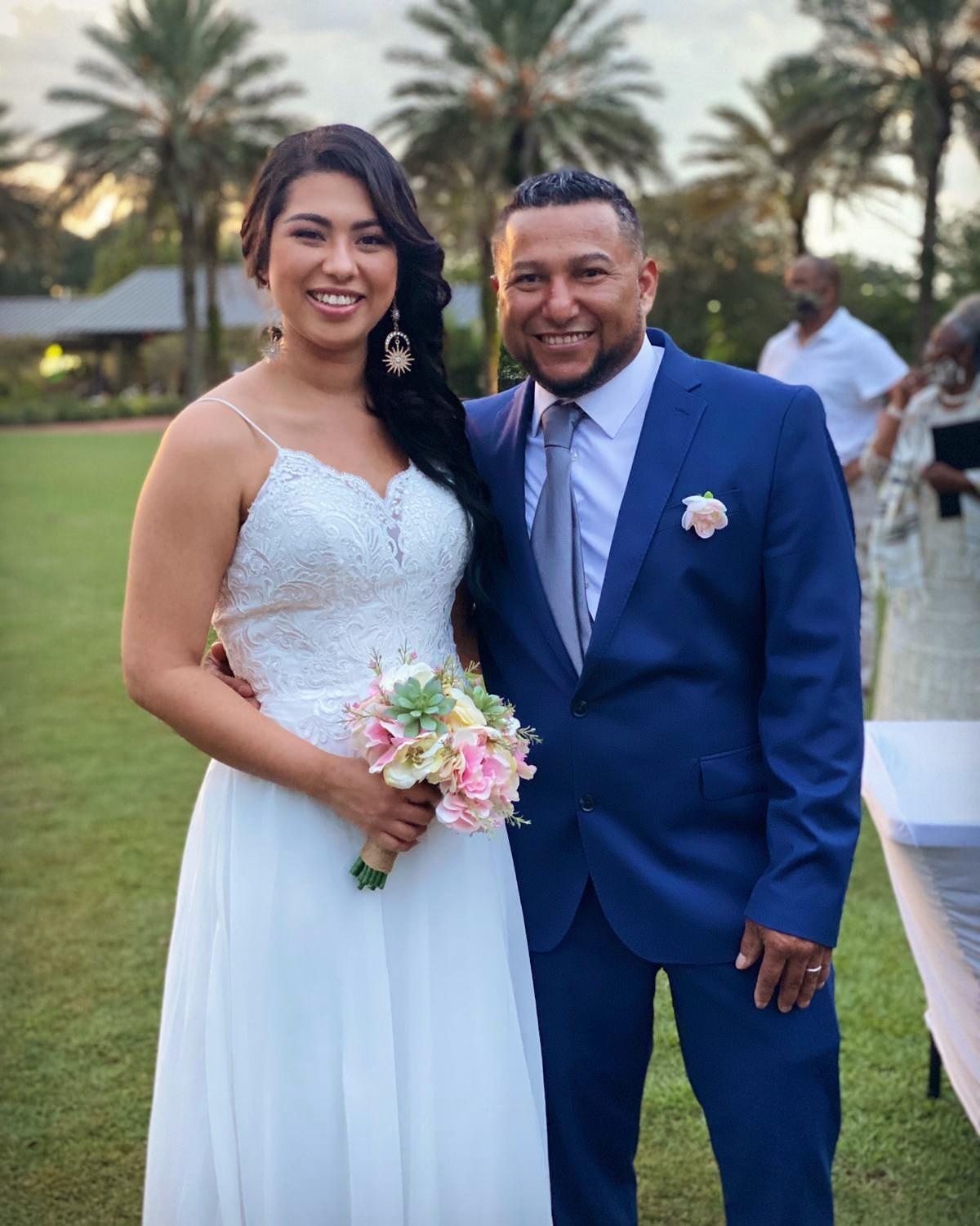 Newlyweds smiling together at an outdoor wedding